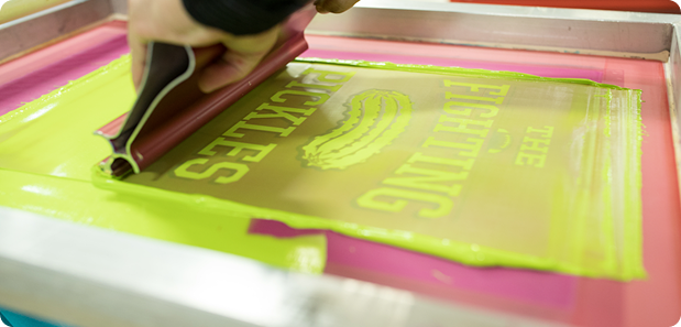 Custom artwork being screen printed